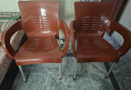 2 Plastic chairs. . .