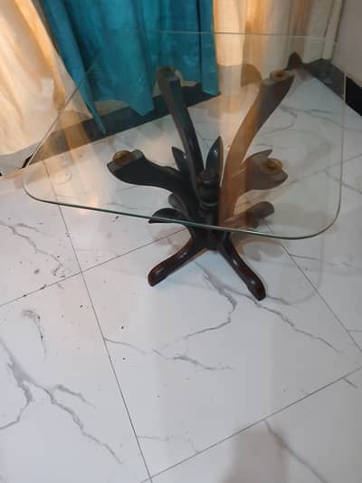 glass top table 2 by 2 in excellent condition wooden legs