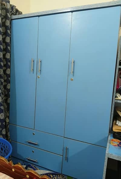 1 3-door wardrobe and 1 study tabels