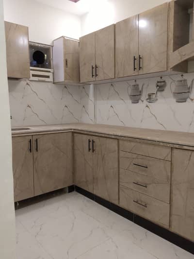 Brand New 2 bed drawing lounge 2nd floor flate for rent tiled flooring America kitchen tiled washrooms 24 hours water and electricity boundary wall project
