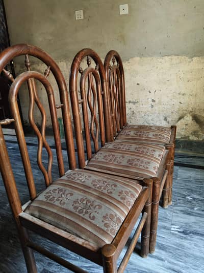 pure wooden dinning table with 6 wooden chairs.
