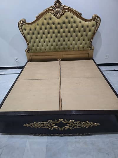 slighlty used wooden bed for sale . condition 9/10