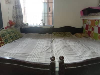 two single beds without mattress