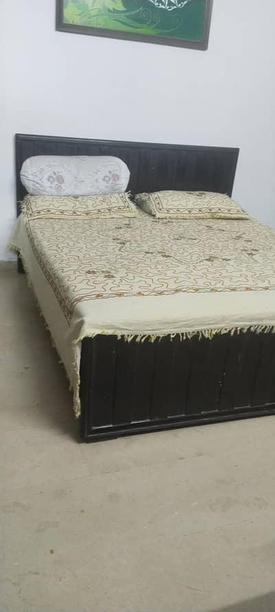 used wooden bed