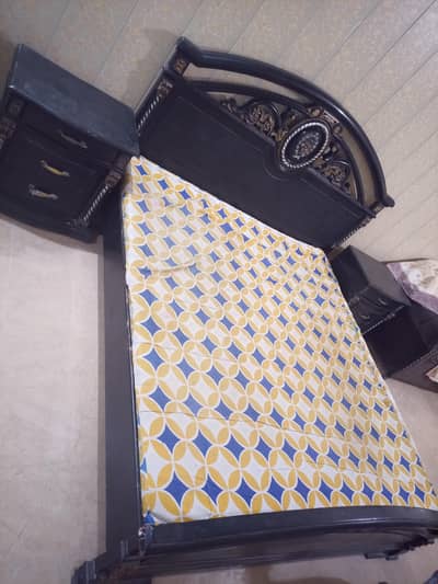 solid wood bed with side table