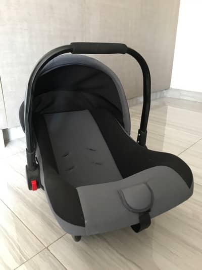 Baby carry cot in black and grey color