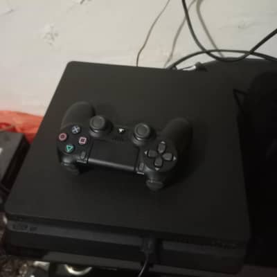 PS4 slim Playstation4 1Tb with two genuine controllers. just like new