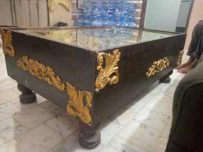 Wooden table with glass  with golden flowers