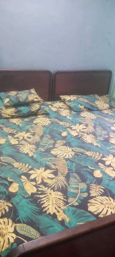 Pair of single wooden beds and Pair of 2 seater sofa 1 table