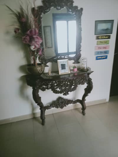 beautifully carved wooden console