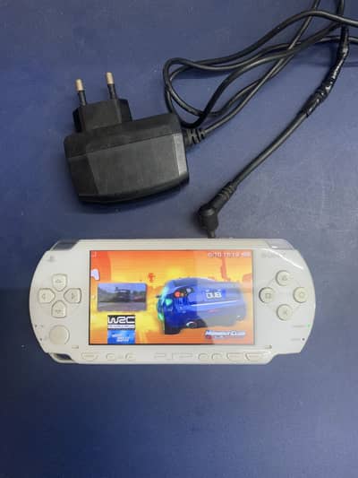 Psp 1003 with games and charger white colour
