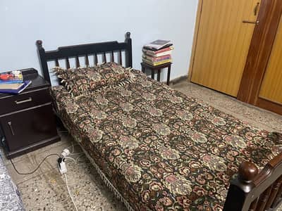 Single wooden bed with foam