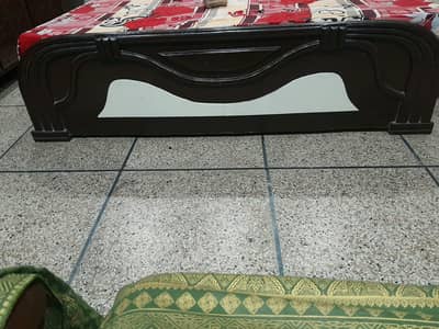 This is a double bed and a dressing table.