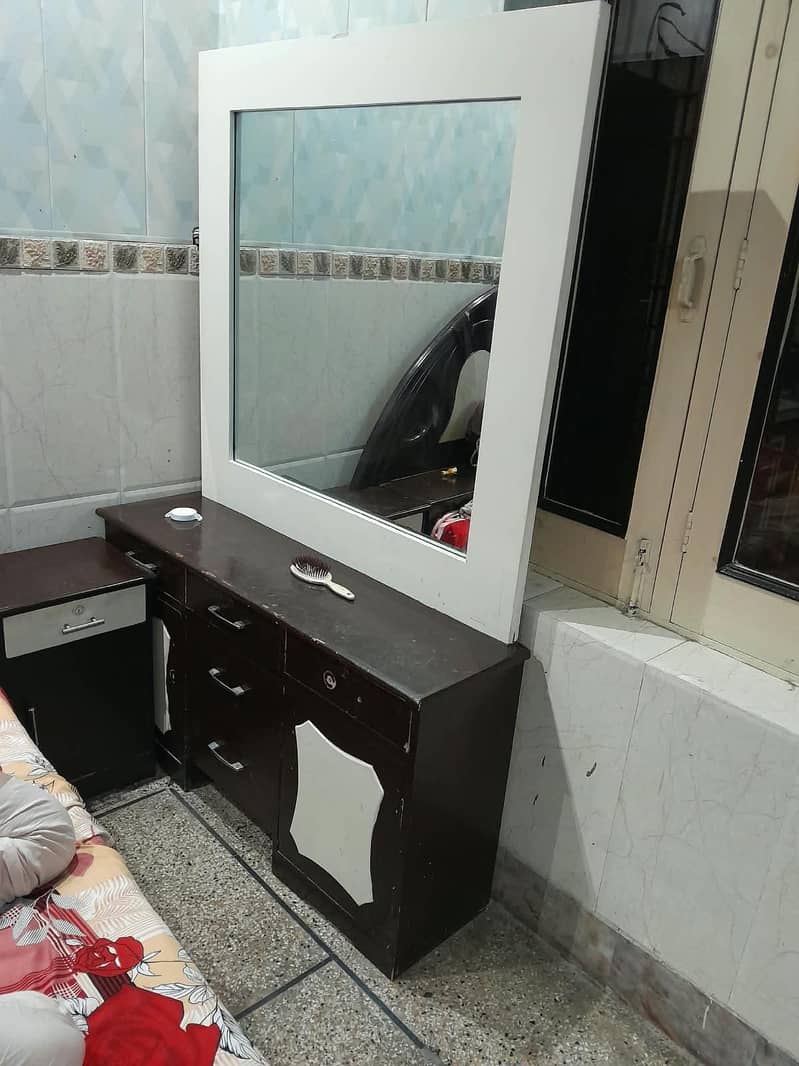 This is a double bed and a dressing table. 1