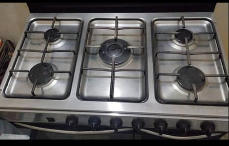5 burner cooking range with baking oven and hot case. perfect working