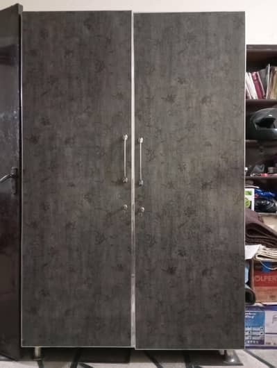 2-door wooden almirah and vertical handles.
