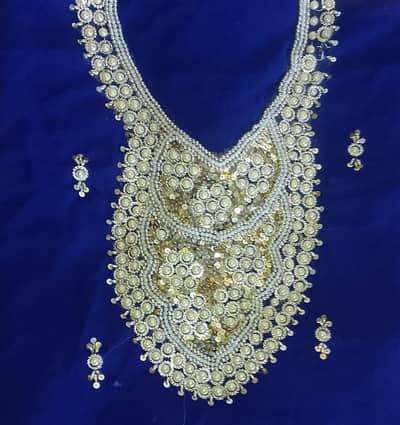 royal blue dress with white embroidery