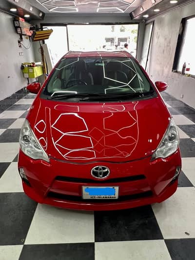 Its toyota prius c Hatch back model which comes in Aqua shape