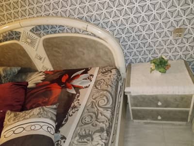 Beautiful bed with mattress and side tables