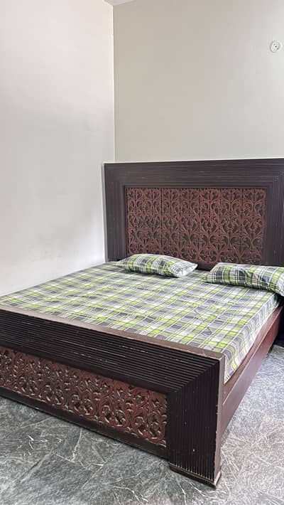 Bed with side tables and dressing table