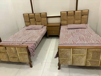 2 single beds with side table without matress