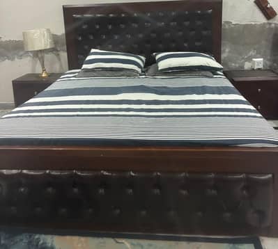 bed with 2 side table and dressing table with mirror