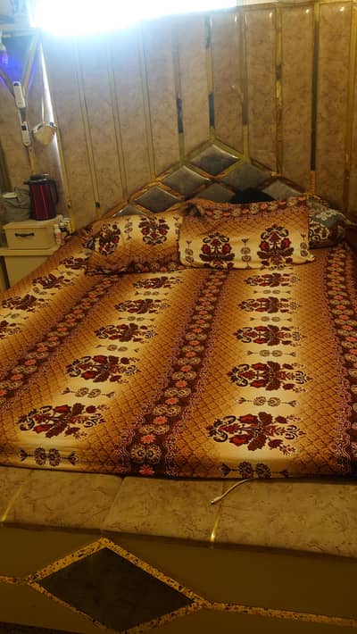 White and Golden color double bed and dressing