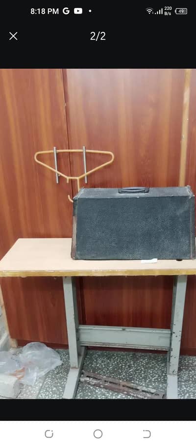 sewing machine singer company with electric motor and stand