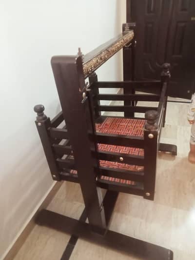 wooden cradle with moveable