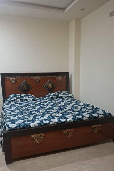 Beautiful Wooden Double Bed with Stylish Carving