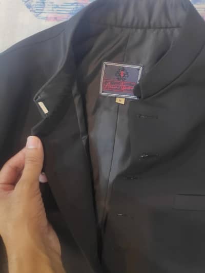 Amir Adnan's plain black sherwani with kurta paijama and qulla set