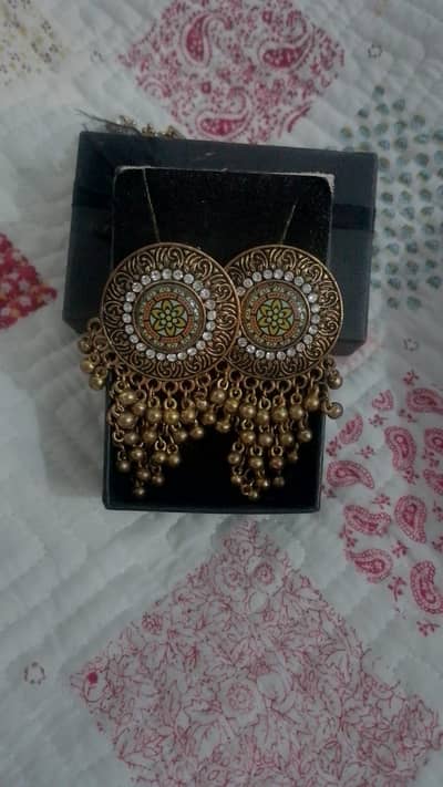 2 pair Afghani and 2 pair golden bridal jhumka. . 1 fancy studs