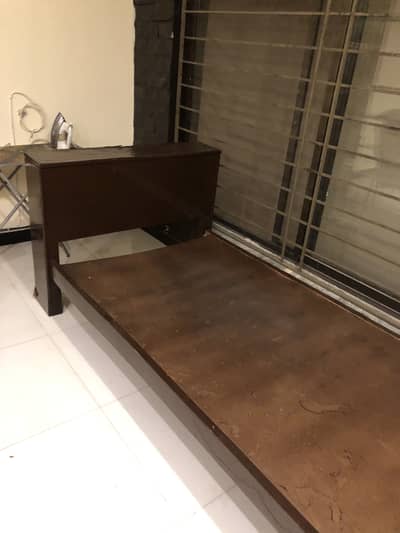 Solid wood single bed with storage compartment