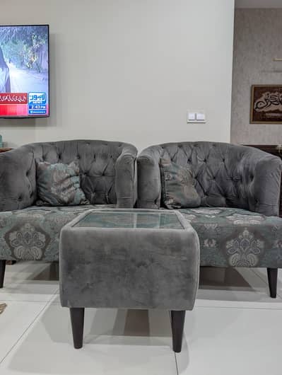 Luxurious Grey Velvet Single Sofa  with Patterned Cushions and Table