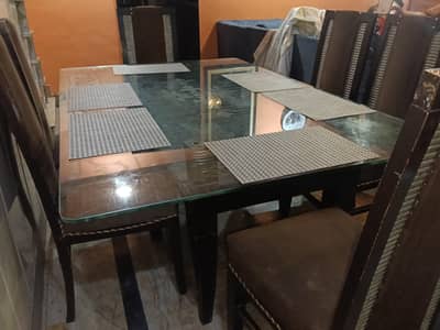 wooden dining table glass on top