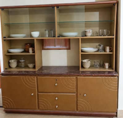 Beautiful wooden crockery showcase with glass doors and cabinets