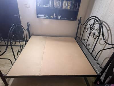 A1 condition Iron bed frame with its 6 Chairs and brand new cushions.