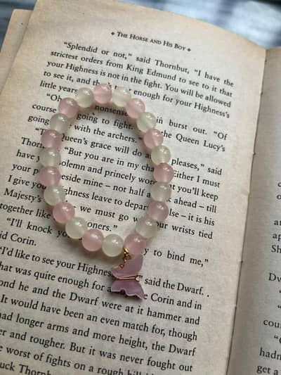 cute white pink bracelet with pink charm. cute and decent for girls