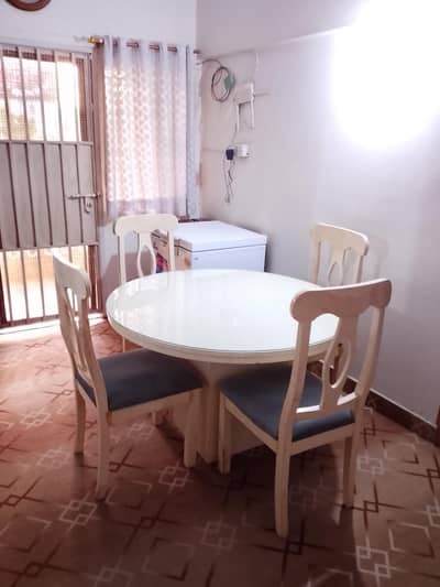 Four chairs round dining table
