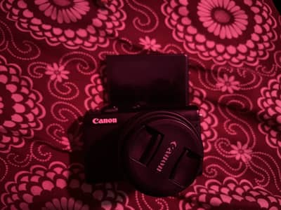 Canon EOS-M100 with orignal kit lens and accessories