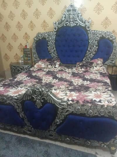 king size bed with side table and dressing