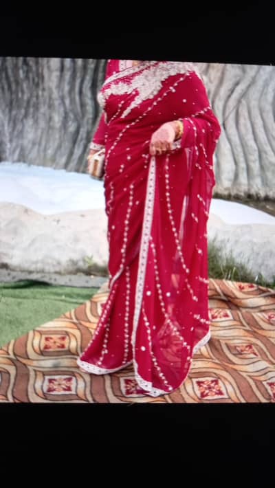 shocking pink saree with heavy stone work