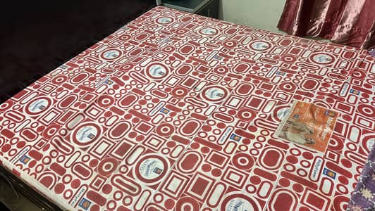 Bed  with two side tables and a mattress