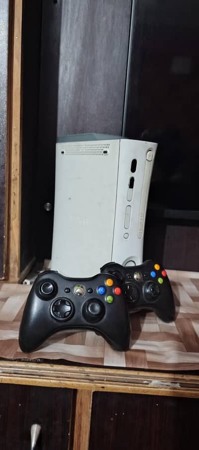 Xbox 360  with 2 wireless controller  and 30 plus games installed