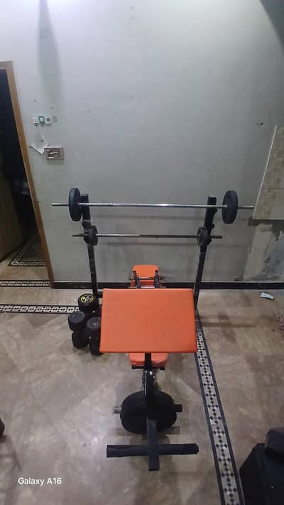 Complete home gym set ( Multi bench,barbells,dumbles & weight plates )