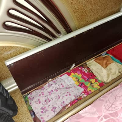Bed and iron stand