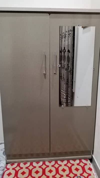 NEW TWO DOOR WARDROBE WITH ATTACHED MIRROR LOCK AND KEYS AND WHEELS