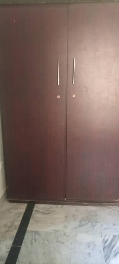 heavy wooden 2 door cupboard