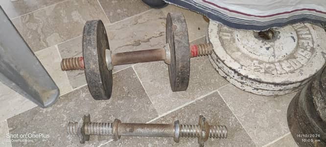 Weight Plates And Two Dumble Rods