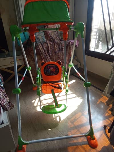 baby swing with canopy_. for sale in good condition